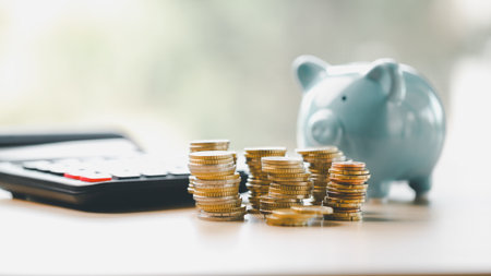 Money box filled with coins, saving cash, banking wisely, making sound investments can build financial wealth, personal finance and overall economy through proper business and currency management.の写真素材