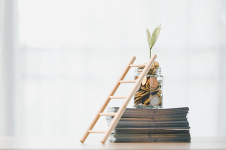 Finance and banking, saving coins, cash, gold while making smart investments in business, currency can build wealth, increase profit, achieve financial success that adds value to overall economy.の写真素材