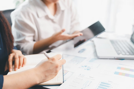 Business meeting, data analytics or women with graph presentation in office. Chart, analysis accounting team brainstorming economy, inflation or solution. business project finance investment concept.の写真素材