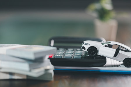 Client legal contract and finance document for business deal involving vehicle, agreements cover car loan, insurance, investment terms, with car key handed over to complete transaction.の写真素材