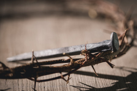Crucifixion of Jesus Christ, nail-pierced hands, crown of thorns, cross, symbol of Christianity, representing holy sacrifice, passion, faith central to Easter celebration, religious tradition.の写真素材
