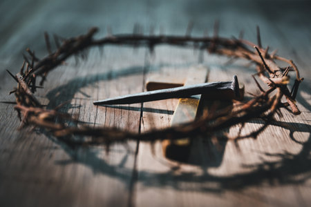 Crucifixion of Jesus Christ, nail-pierced hands, crown of thorns, cross, symbol of Christianity, representing holy sacrifice, passion, faith central to Easter celebration, religious tradition.の写真素材