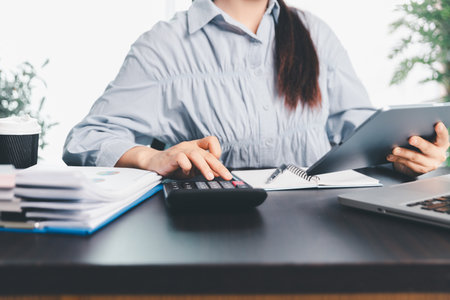 Business woman analyze calculate company financial, tax results office accounting statistics analytical research. calculating business balance prepare tax reduction. Tax deduction planning concept.の写真素材