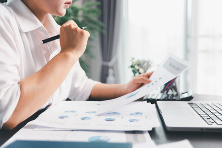 Business woman analyze calculate company financial, tax results office accounting statistics analytical research. calculating business balance prepare tax reduction. Tax deduction planning concept.の写真素材