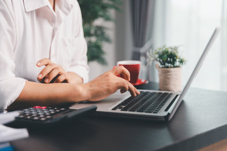 Business woman analyze calculate company financial, tax results office accounting statistics analytical research. calculating business balance prepare tax reduction. Tax deduction planning concept.の写真素材