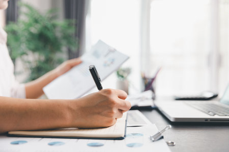 Business woman analyze calculate company financial, tax results office accounting statistics analytical research. calculating business balance prepare tax reduction. Tax deduction planning concept.の写真素材