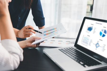 Business meeting, data analytics or women with graph presentation in office. Chart, analysis accounting team brainstorming economy, inflation or solution. business project finance investment concept.の写真素材