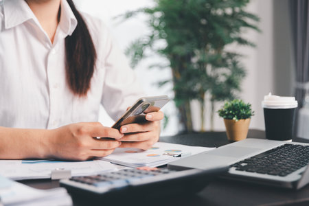 Business woman analyze calculate company financial, tax results office accounting statistics analytical research. calculating business balance prepare tax reduction. Tax deduction planning concept.の写真素材