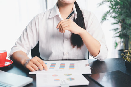 Business woman analyze calculate company financial, tax results office accounting statistics analytical research. calculating business balance prepare tax reduction. Tax deduction planning concept.の写真素材