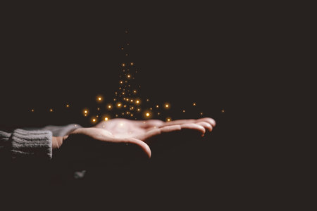 Hands holding glowing light, symbolizing hope, healing, faith, inspiration, spiritual energy, new beginning, miracle, inner strength and positive transformation from darkness to light.の写真素材