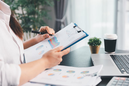 Business woman analyze calculate company financial, tax results office accounting statistics analytical research. calculating business balance prepare tax reduction. Tax deduction planning concept.の写真素材
