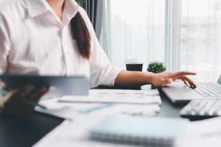 Business woman analyze calculate company financial, tax results office accounting statistics analytical research. calculating business balance prepare tax reduction. Tax deduction planning concept.の写真素材