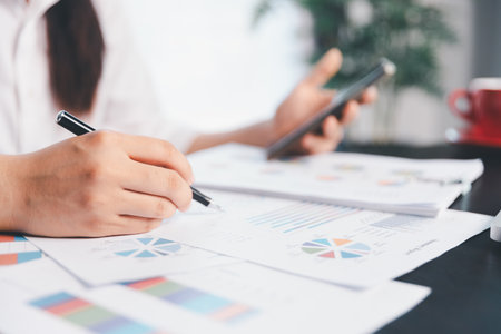 Business woman analyze calculate company financial, tax results office accounting statistics analytical research. calculating business balance prepare tax reduction. Tax deduction planning concept.の写真素材