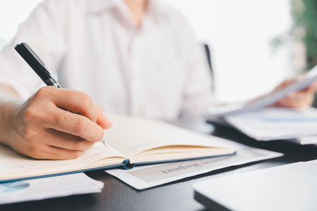 Business woman analyze calculate company financial, tax results office accounting statistics analytical research. calculating business balance prepare tax reduction. Tax deduction planning concept.の写真素材