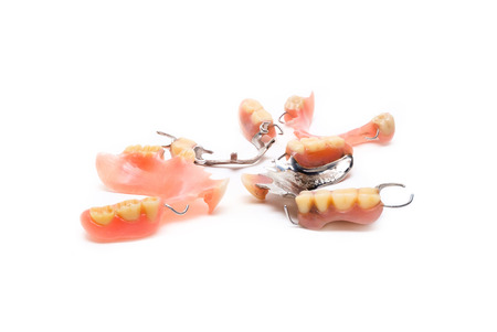 old man real denture with plastic type and stainless steal type.の写真素材