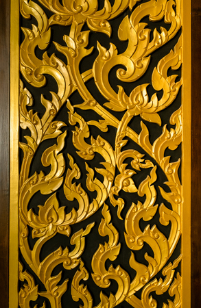 Thai traditional style door golden color close upの写真素材