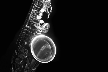 low key alto saxophone and light in the dark background black and whiteの写真素材