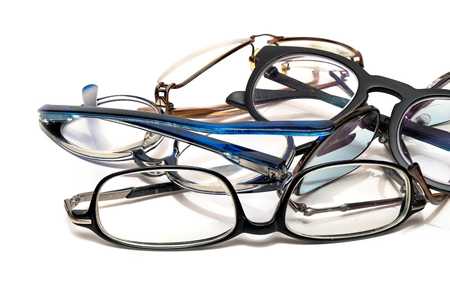 group of unused old eyeglasses from male and female on isolated white background.の写真素材