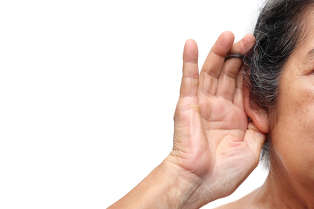 Old woman paying attention to listening sound, Age-related hearing loss problem in elderly.
の写真素材