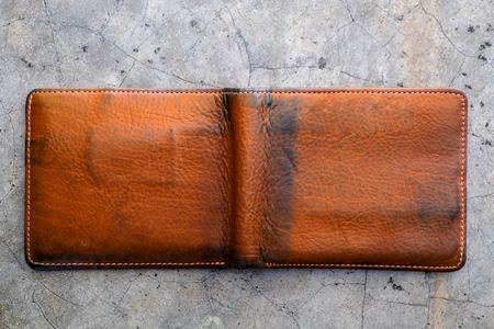 Old wallet texture on concrete floor background. empty purse with nobody.の写真素材