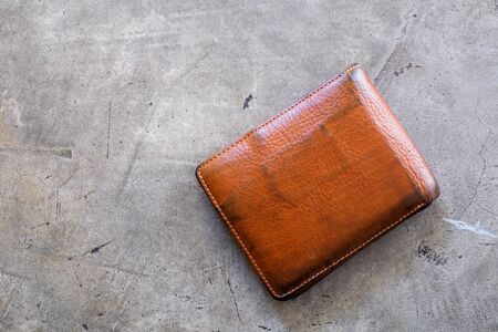Old wallet texture on concrete floor background. empty purse with nobody.の写真素材