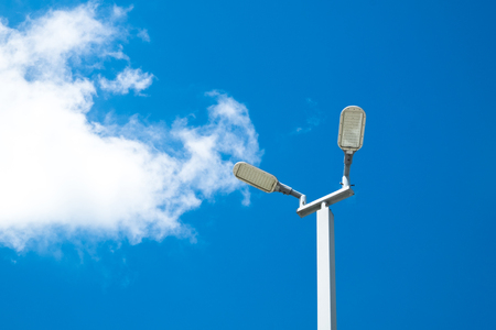 Solar cells LED light in blue sky with clouds. Eco and Clean Power concept.の写真素材