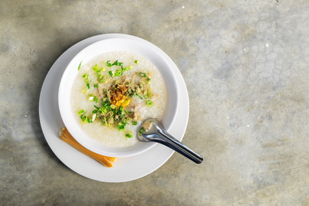Pork Congee on the concrete table, Morning Breakfast.の写真素材