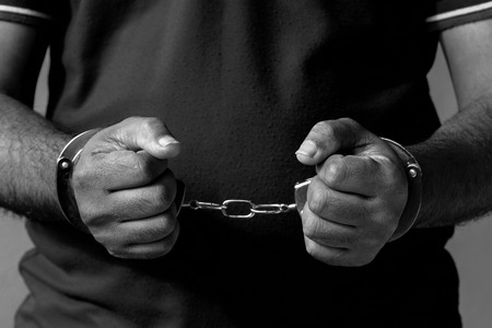 Man under Arrest, Criminal Scence of Man get Caught with Handcuffed by the Policeman.の写真素材