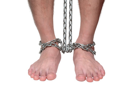 Male Prisoner Chain Bondage on the Floor, Concept of Violence and Criminal iSolated White Background.の写真素材