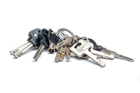 Bunch of Many Keys Lies on an iSolated White Background.