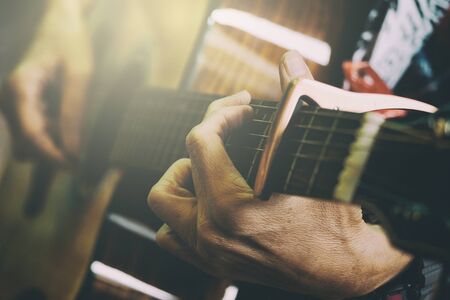 Adult Male Playing Acoustic Guitar, Vintage Picture Style Added.