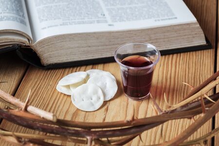 Holy Communion, a Cup of Wine and Bread with a Jesus Crown Thorn and Holy Bible.の写真素材