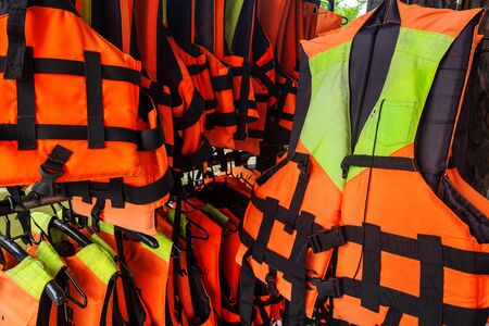 Row of Various Size Life Jacket for the Tourist.