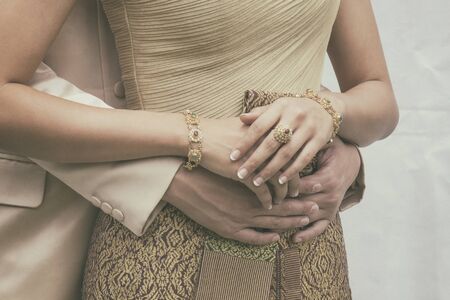 Bride And Groom Holding Together in the Thai Traditional Dress Style, Vintage Retro Picture Style Added.の写真素材