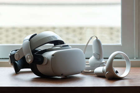 Virtual Reality Headset on the Wood Table in the Morning, Interactive Next Generation Computer...