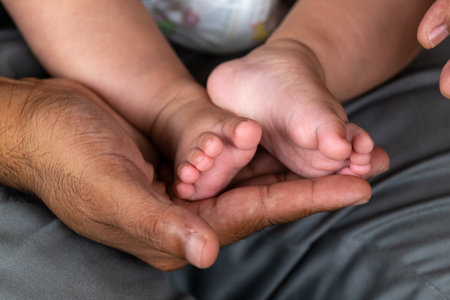 Dad Hold His Baby Daughter on His Arms with Love and Care. Family and Father love.