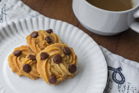 Fresh Homemade Chocolate Chip Cookie on the Table, Traditional Crispy Crunchy Snack with Coffee.