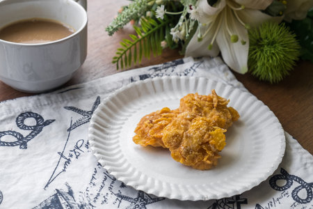 Fresh Homemade Cornflake Cookie on the Table, Traditional Crispy Crunchy Snack with Coffee.の写真素材