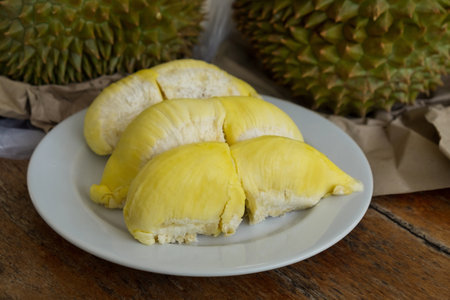 Durian the King of Fruits on White Plate, Ripe and Fresh Golden Durian with Tasty Sweet Fruit.の写真素材