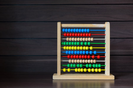 School Abacus with Colorful Beads on Wood Background, Kids Learning Equipment, Mathematics Class Stationary Concept.の写真素材