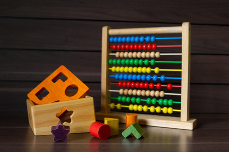 Colourful Wooden Toy on Wooden Background, Kindergarten Geometrics Shape for Creative and Educate Development.の写真素材