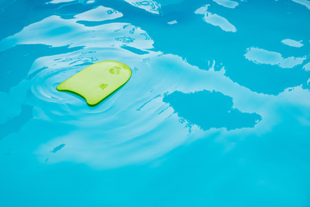 New Green Foam Board for Practice Swimming in a Beautiful Swimming Pool with no People.