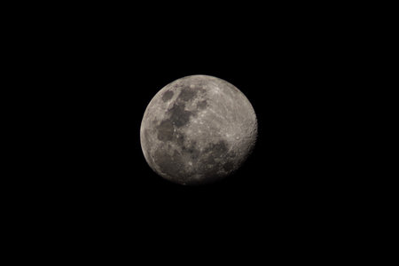 The Nearly Full Moon On a Cloudless Night, with no Clouds Obscuring the Details.の写真素材
