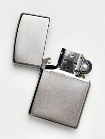 Windproof Oil lighter on the isolated white background, popular and  fashionable vintage look...
