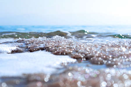 Dead Sea coastline with white salt beach in Ein Bokek, Israel. Famous Middle East health landmark....