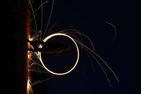 Iron wool circle drawing light fireworks. Burning Steel Wool spinning, Trajectories of burning...