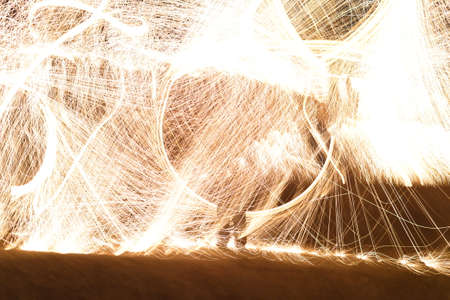 Iron wool circle drawing light fireworks. Burning Steel Wool spinning, Trajectories of burning...