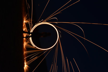 Iron wool circle drawing light fireworks. Burning Steel Wool spinning, Trajectories of burning...