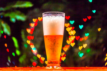 bubbles of drink in glass have heart shape.fill drink in to glass can see at bubbles are heart...