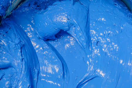 red color of plastisol ink flowed out of the barrel. plastisol ink is specially for print on tee shirts and any fabric. the ink useful in tee shirt factory garment and industry for exportの写真素材